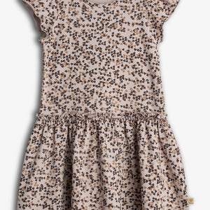 A child's dress with flutter sleeves features a pattern of small, clustered floral designs in black and brown. It is set against a plain white background.
