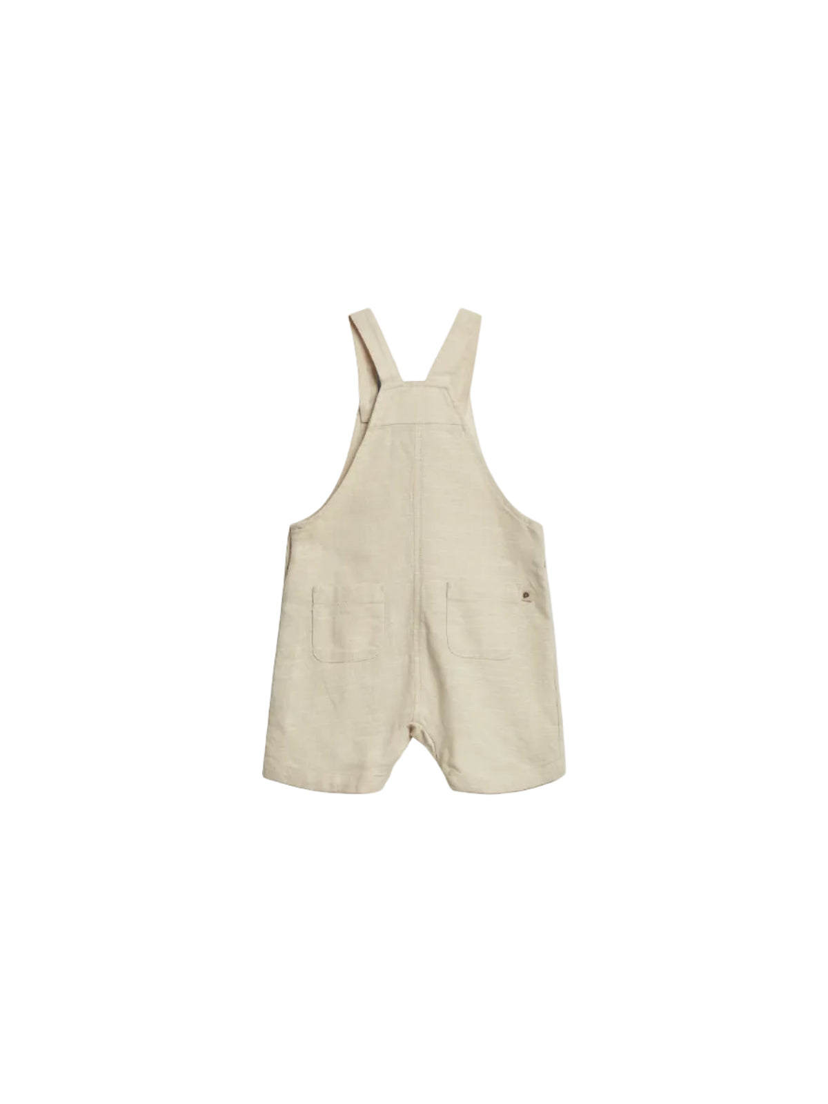 A beige linen romper with shoulder straps features two front pockets. The garment lies flat against a neutral background, emphasizing its casual, minimalist style.