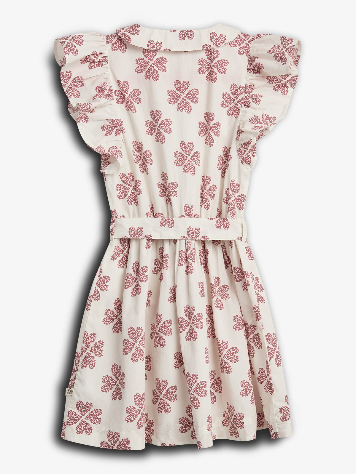 A white, knee-length dress features red floral patterns and ruffled sleeves. The dress hangs against a neutral background, showcasing its elegant and simple design.