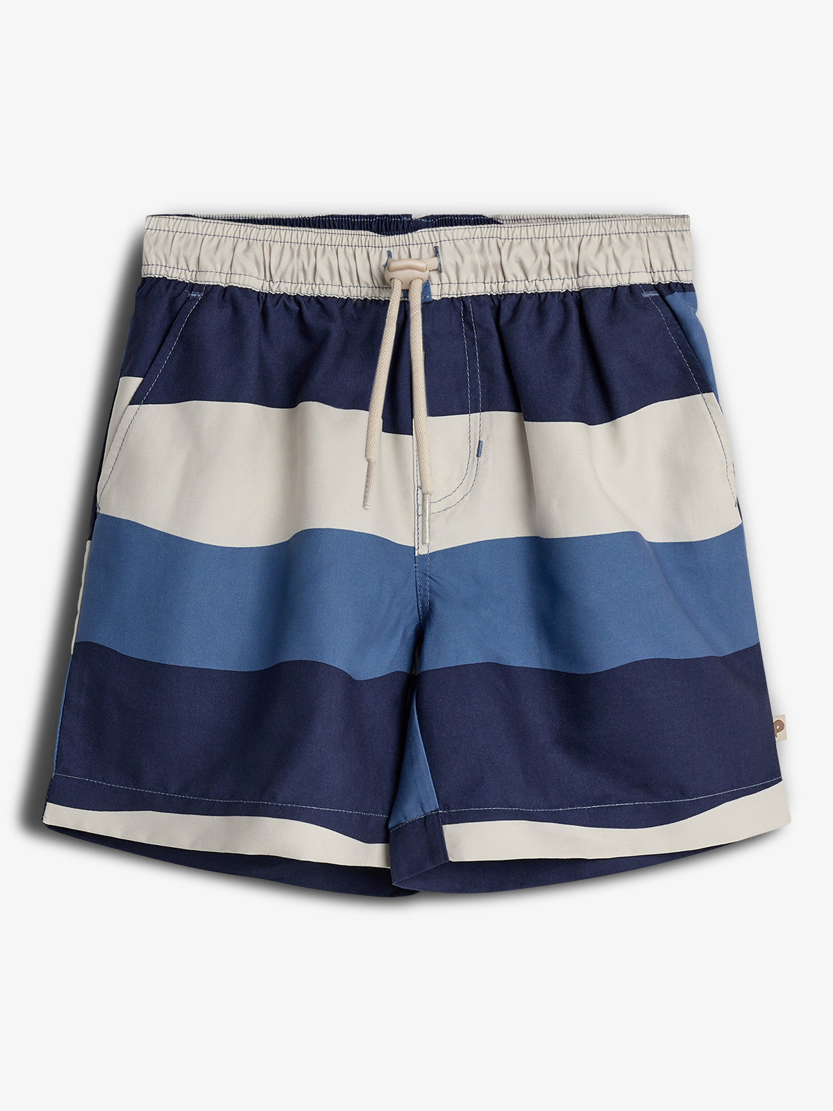 Striped swim trunks with an elastic waistband and drawstring are laid flat. They feature alternating wide bands of navy blue, light blue, and beige, set against a plain white background.