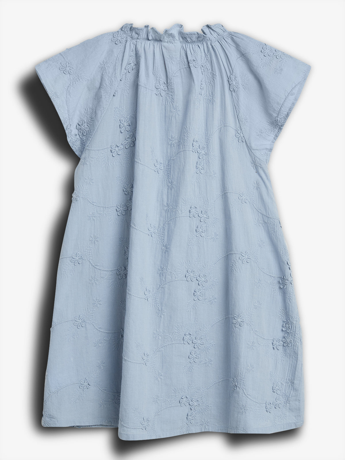 A light blue, short-sleeved, floral-patterned dress with gathered neckline detail is displayed against a plain white background.