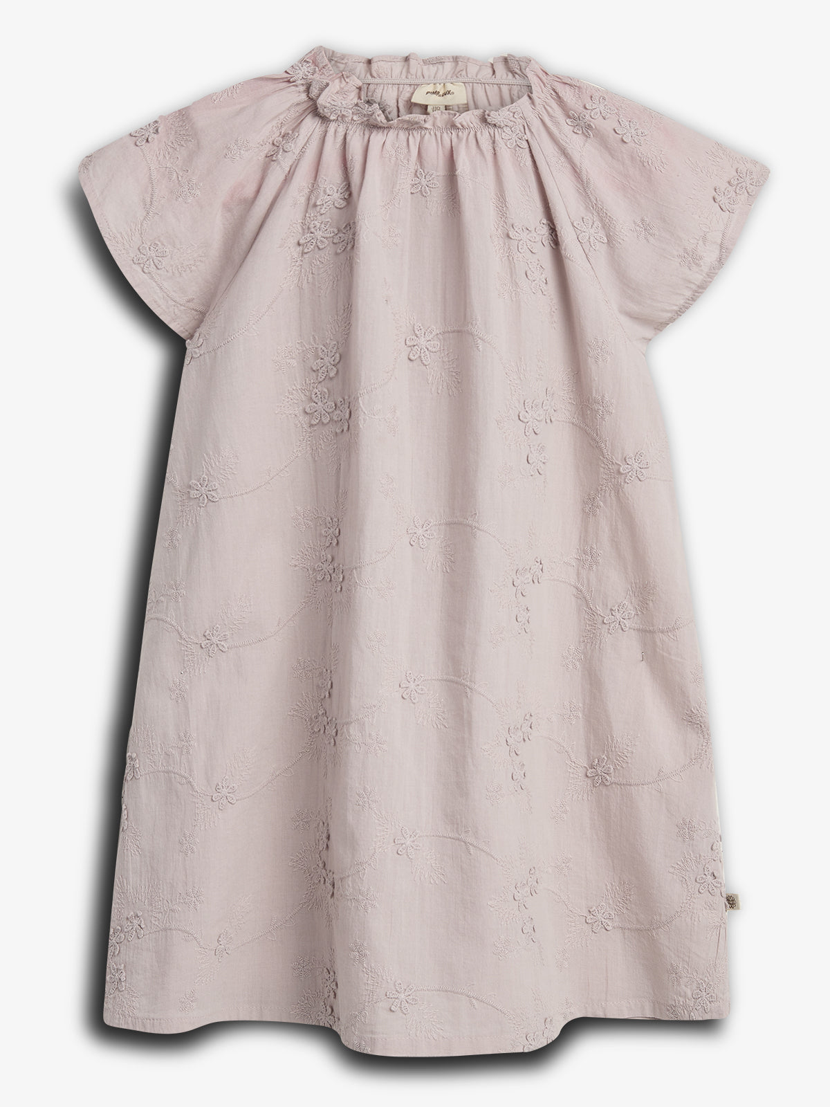 A light pink, embroidered short-sleeve dress with floral patterns hangs against a plain background. The dress features a gathered neckline, creating a soft, elegant appearance.