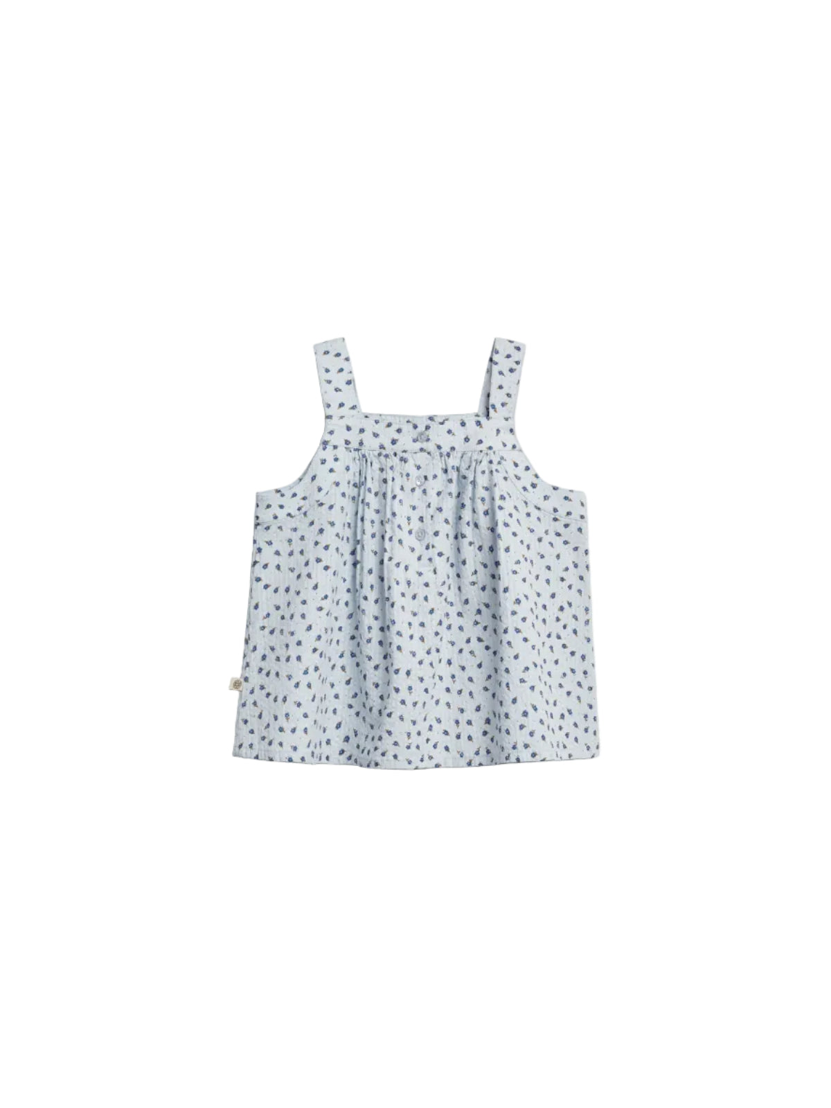 A light blue sleeveless top with thin straps features small blue floral patterns and buttons down the front, set against a plain white background.