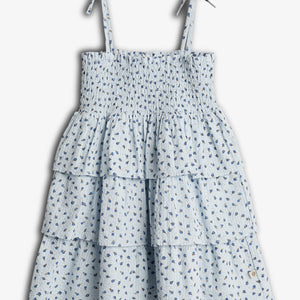 A light blue, floral-patterned dress with tiered ruffles and thin straps tied at the shoulders, displayed against a white background.