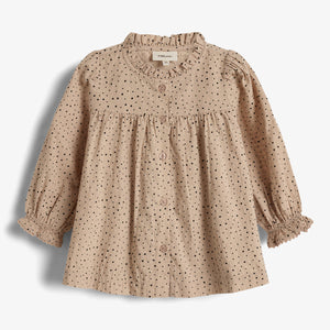 A beige, long-sleeve child's blouse with black polka dots, buttons down the front, and elastic ruffle cuffs. The label reads "PlayUp" at the inside collar. Against a plain white background.