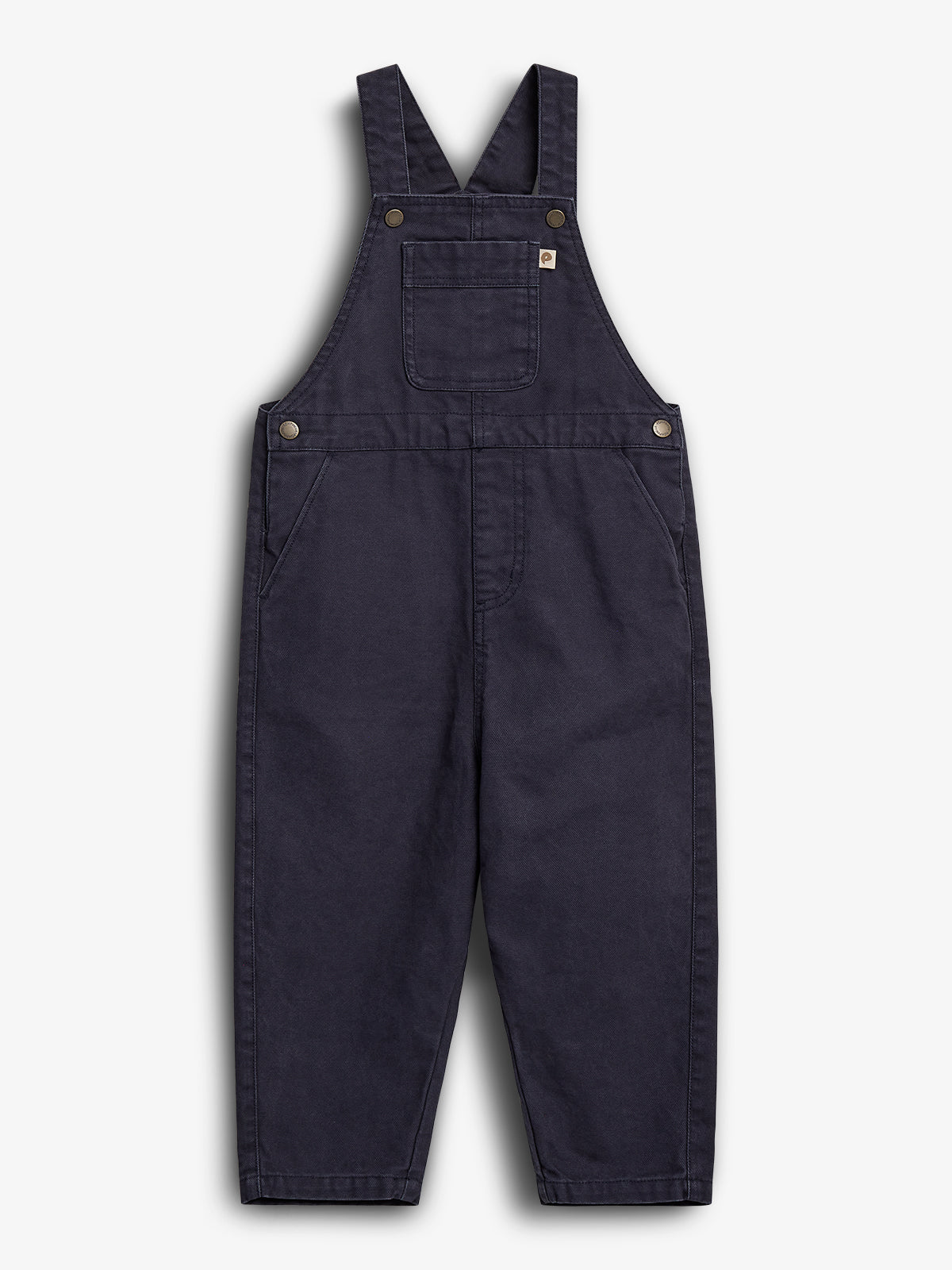 Dark blue overalls with adjustable shoulder straps and front pocket, lying flat on a plain white background. Made from durable fabric and featuring metal button attachments on the sides.