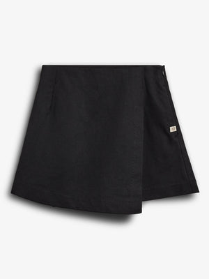 A black, A-line mini skirt with a wrap-style front and a small tag on the right side. Displayed against a solid white background.