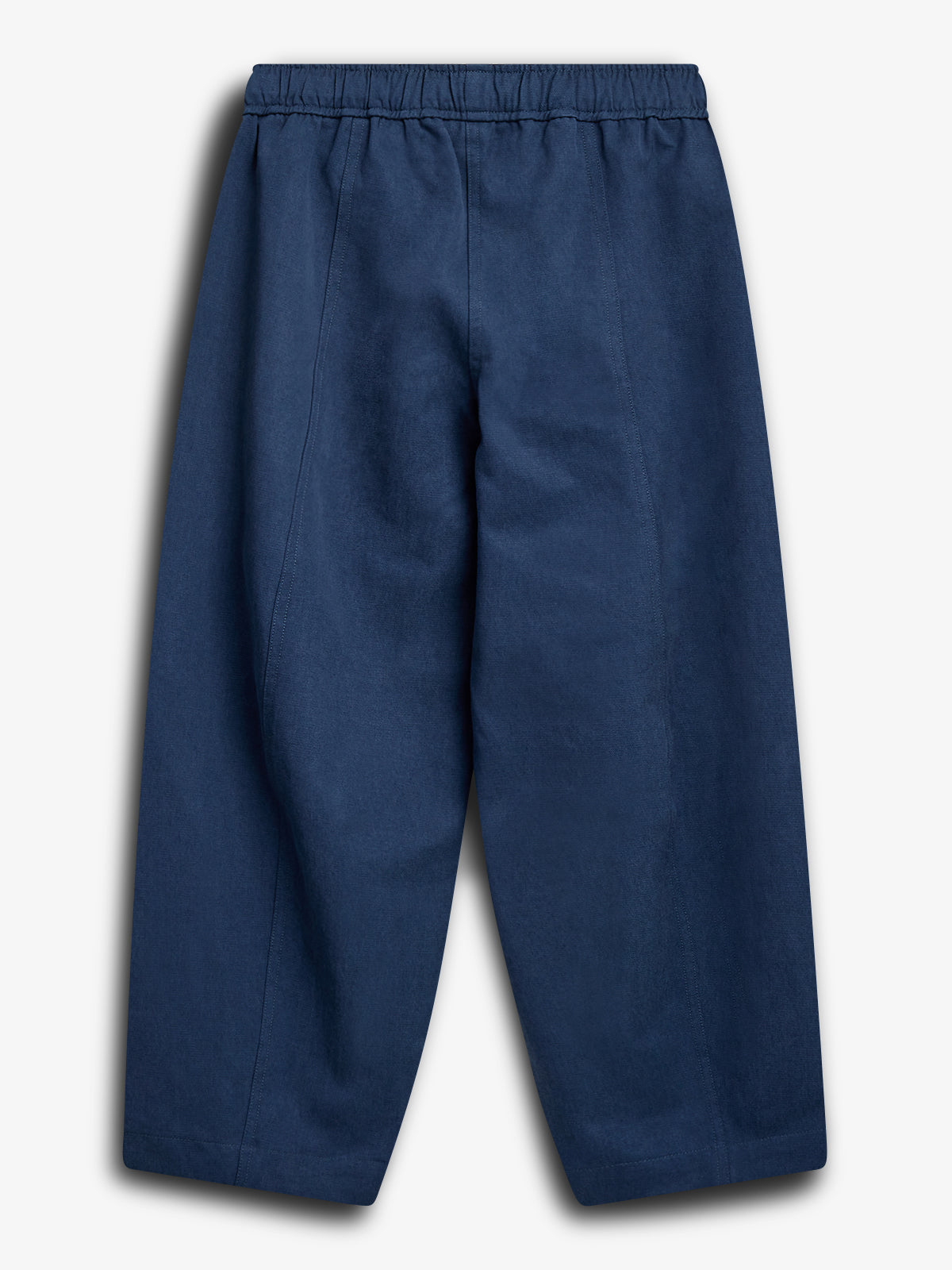 Navy blue pants hang against a plain white background. They feature an elastic waistband and straight, wide legs, creating a relaxed, casual appearance.