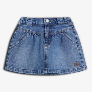 Denim skirt with button closure and two front pockets. It features a small embroidered design near the bottom hem. Displayed against a plain, white background.
