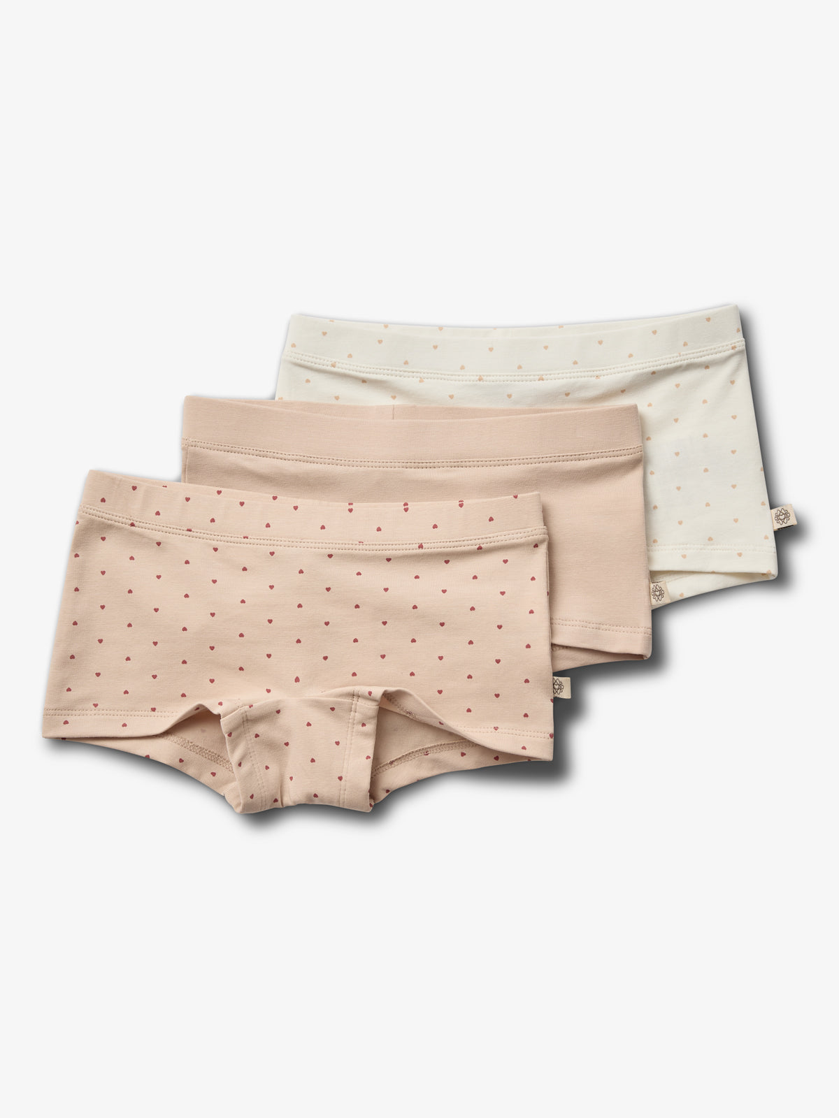 Three pairs of women's pastel underwear are arranged in a staggered stack. Each pair features small heart patterns and is set against a plain white background.