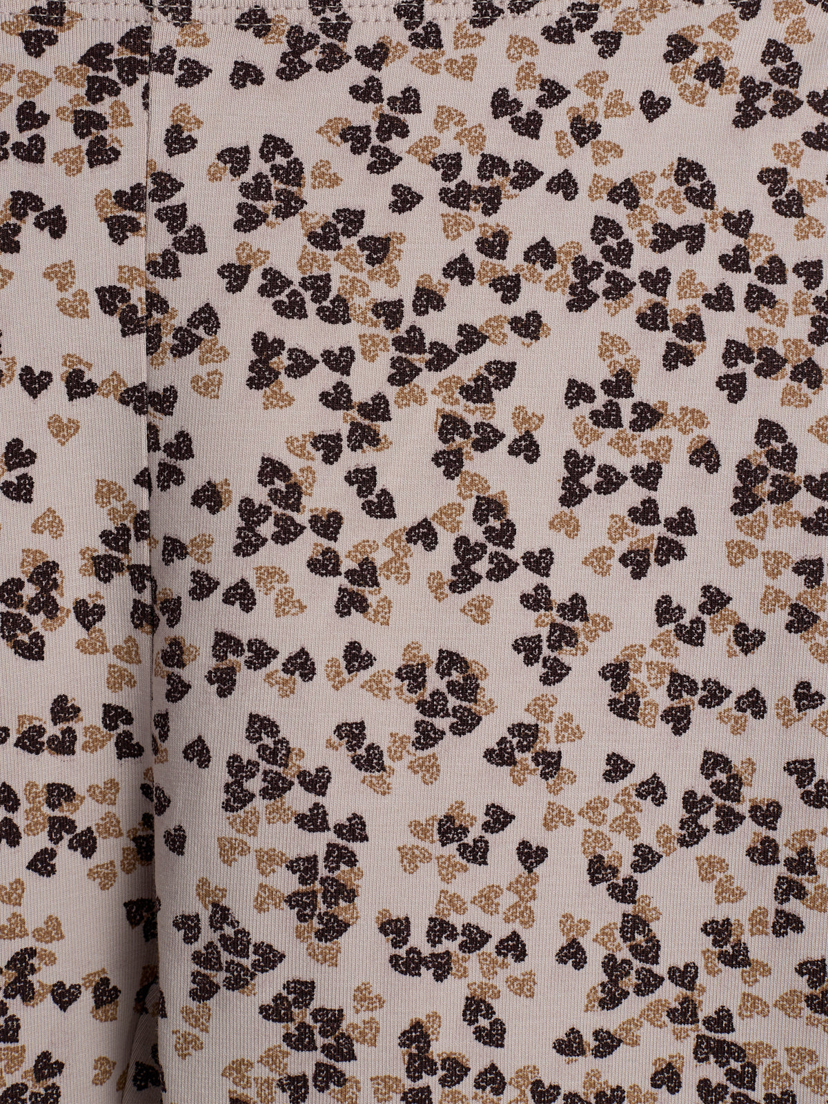 Fabric with clusters of small, abstract floral patterns in dark and light brown on a beige background. The pattern is evenly distributed, creating a textured, decorative effect.