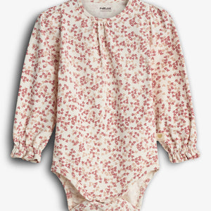 A long-sleeved baby onesie with a red floral pattern on a cream background. "POPUPSHOP ORGANIC COTTON" is printed on the label inside the collar, set against a plain backdrop.