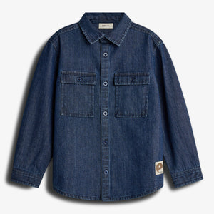 A blue denim shirt with long sleeves and a button-down front displayed against a plain white background. It features two chest pockets and a small label with "p" and "populus."