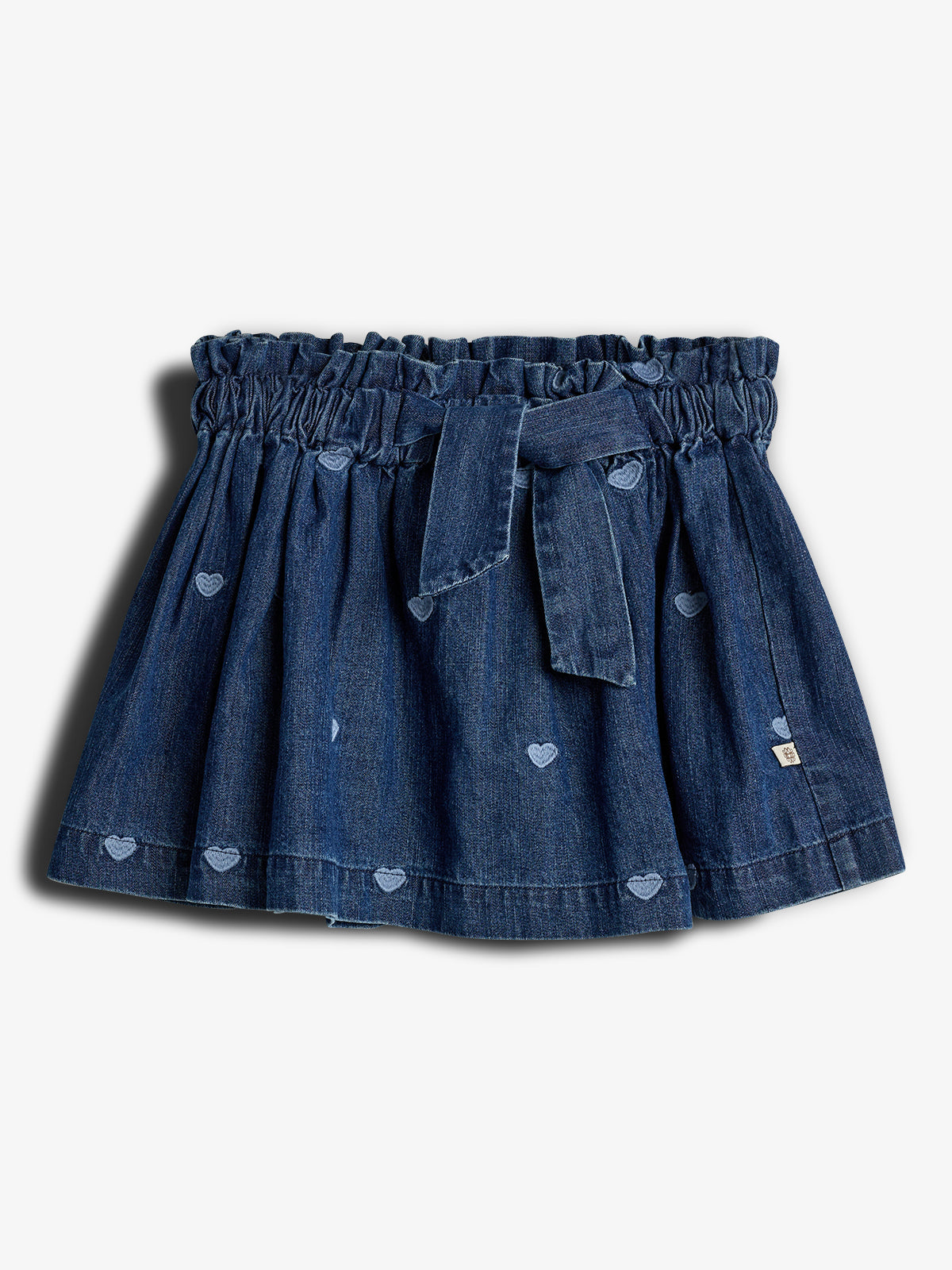 Denim skirt with elastic waistband and bow, featuring small heart patterns throughout. Set against a plain white background.