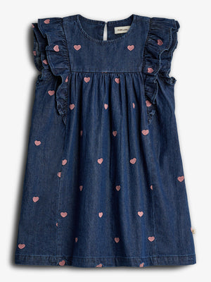 Dark denim dress features embroidered pink hearts and ruffled sleeves. It hangs flat against a white background. The label reads "POMPdeLUX" at the neck.