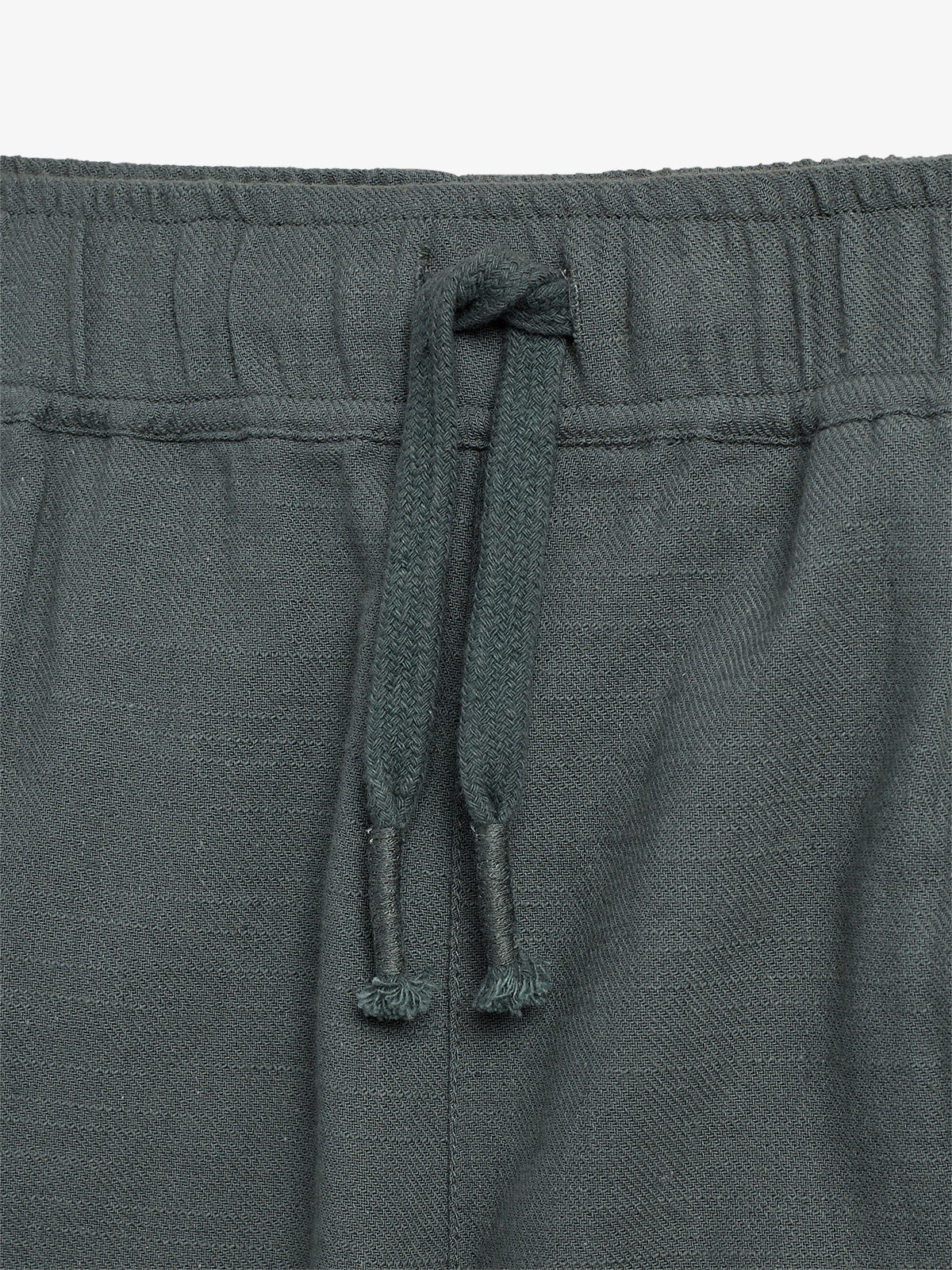 A pair of dark gray pants with an elastic waistband, featuring a textured drawstring tied in a loose knot, displayed against a plain white background.
