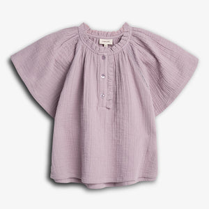 Purple, short-sleeved baby shirt with ruffled collar and buttoned front, displayed on a plain white background. A label reads "PINIPUKE."