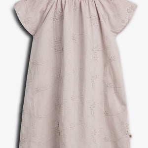 A light pink, embroidered short-sleeve dress with floral patterns hangs against a plain background. The dress features a gathered neckline, creating a soft, elegant appearance.