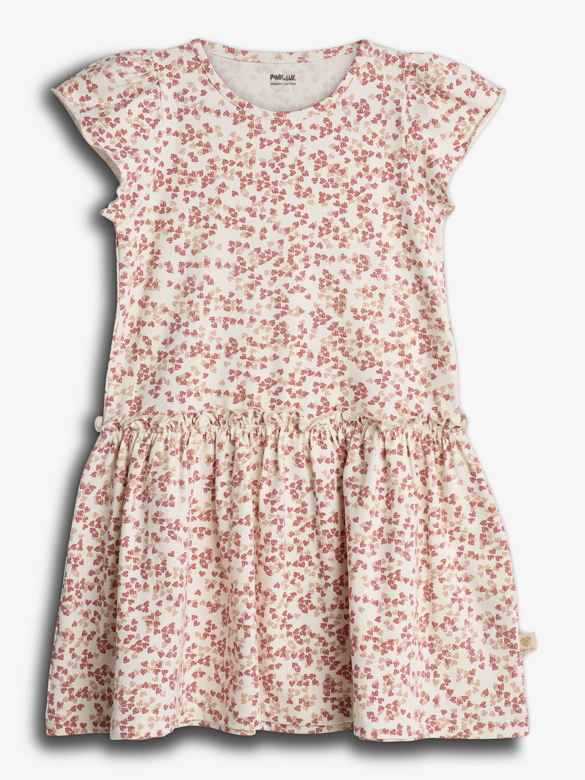 A white dress featuring red floral patterns, displayed on a plain white background. The dress has short sleeves, a round neckline, and a gathered skirt. Label reads "Pamp Luxe."