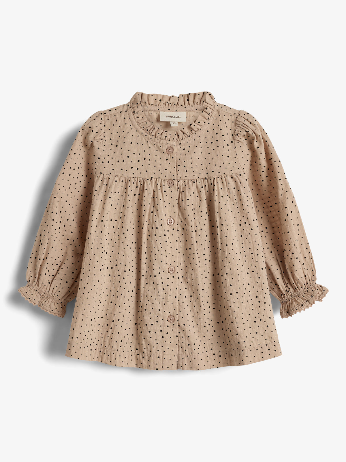 A beige, long-sleeve child's blouse with black polka dots, buttons down the front, and elastic ruffle cuffs. The label reads "PlayUp" at the inside collar. Against a plain white background.