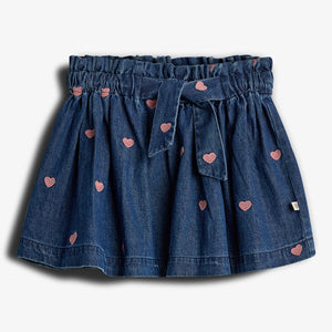 Denim skirt featuring pink heart patterns and a tied waistband, set against a plain white background.