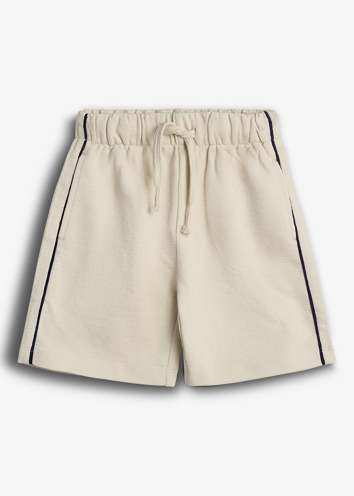 Beige shorts with an elastic waistband and drawstring, featuring dark vertical stripes on the sides, displayed against a plain white background.