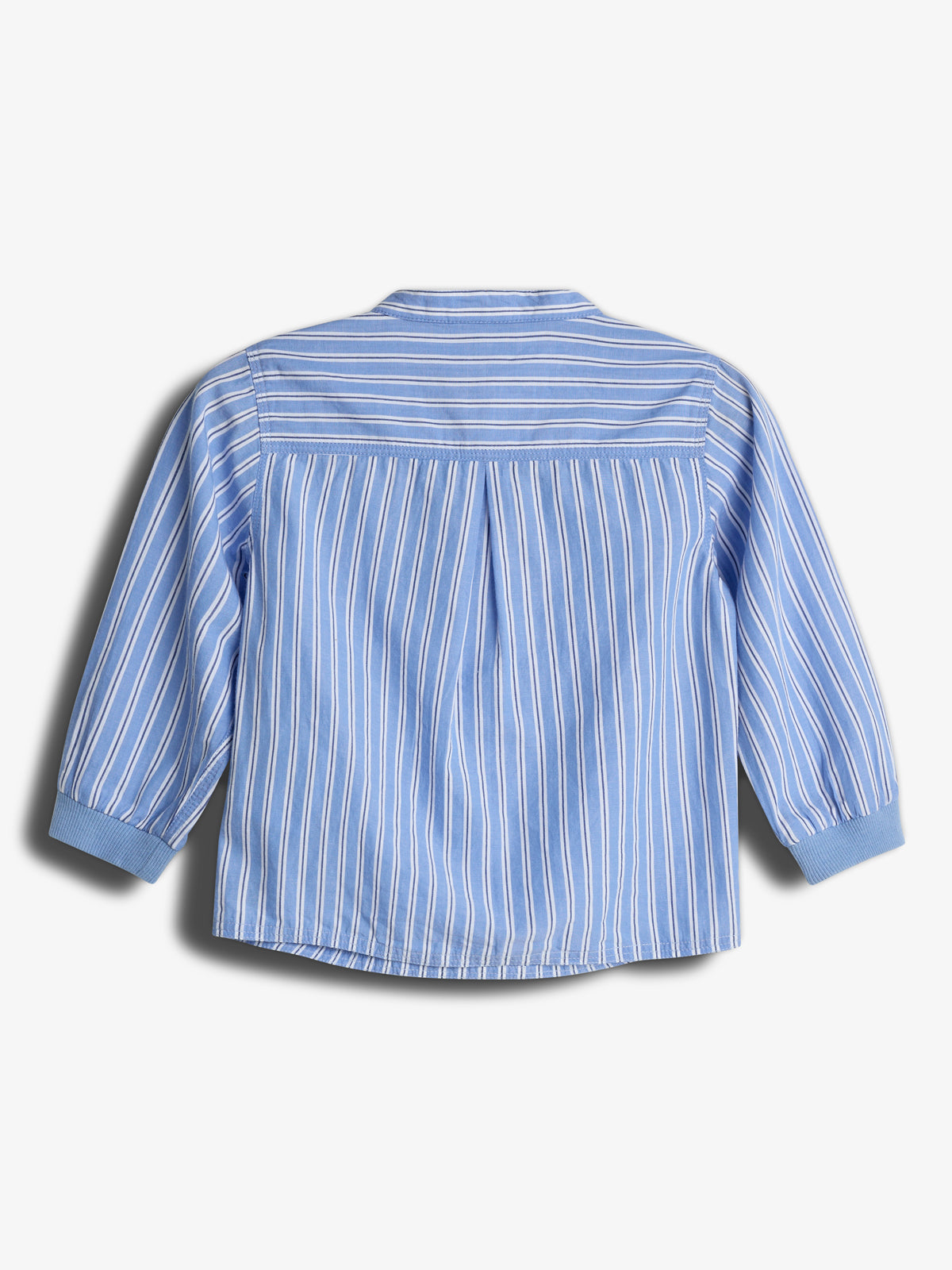 A blue and white vertically striped long-sleeve shirt is laid flat, showing its back view. The shirt has a band collar and pleated detail, set against a plain white background.