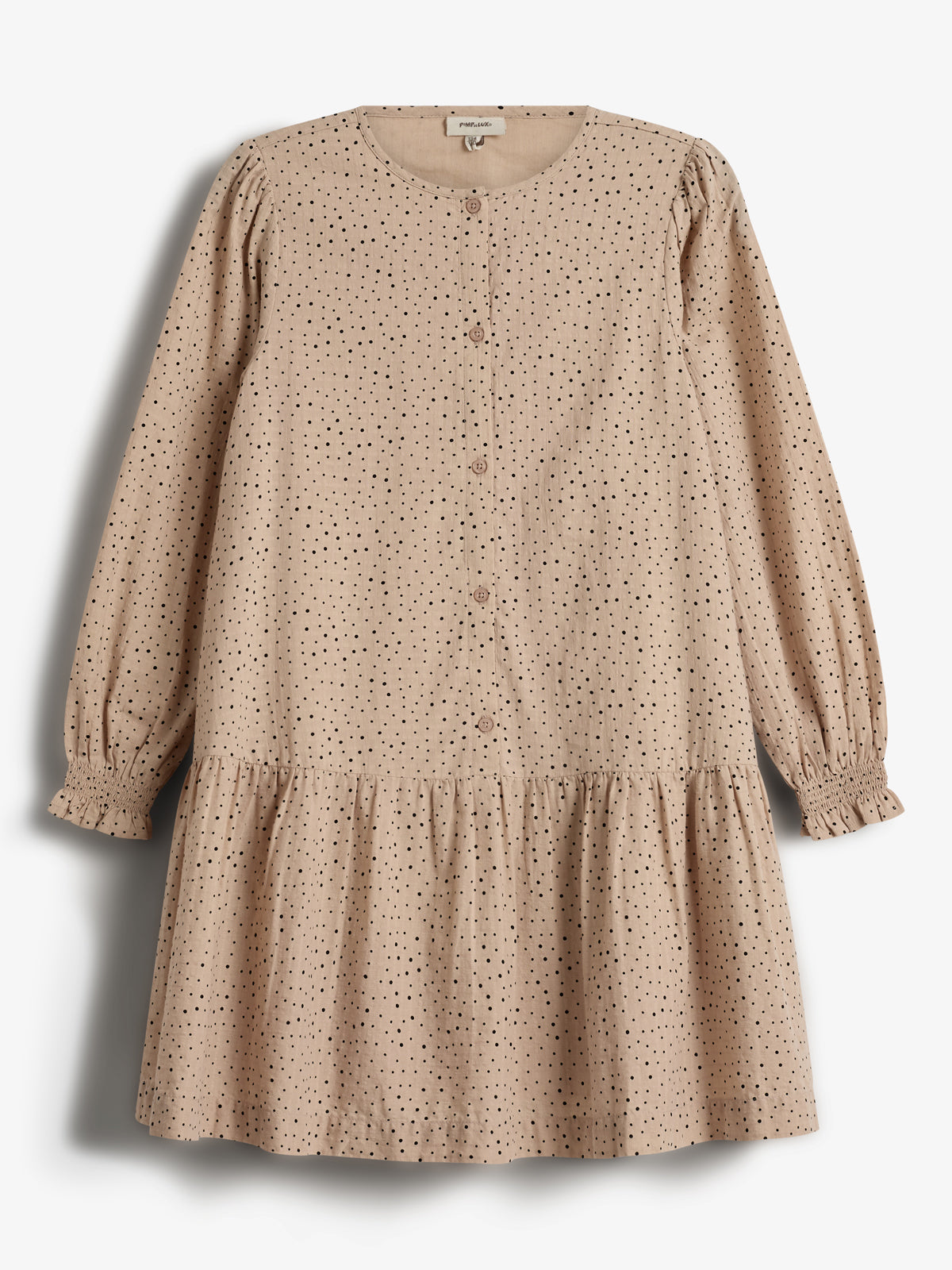 A tan, long-sleeved dress with black polka dots is neatly displayed. It features buttons down the front and a gathered hem, hanging against a plain white background.