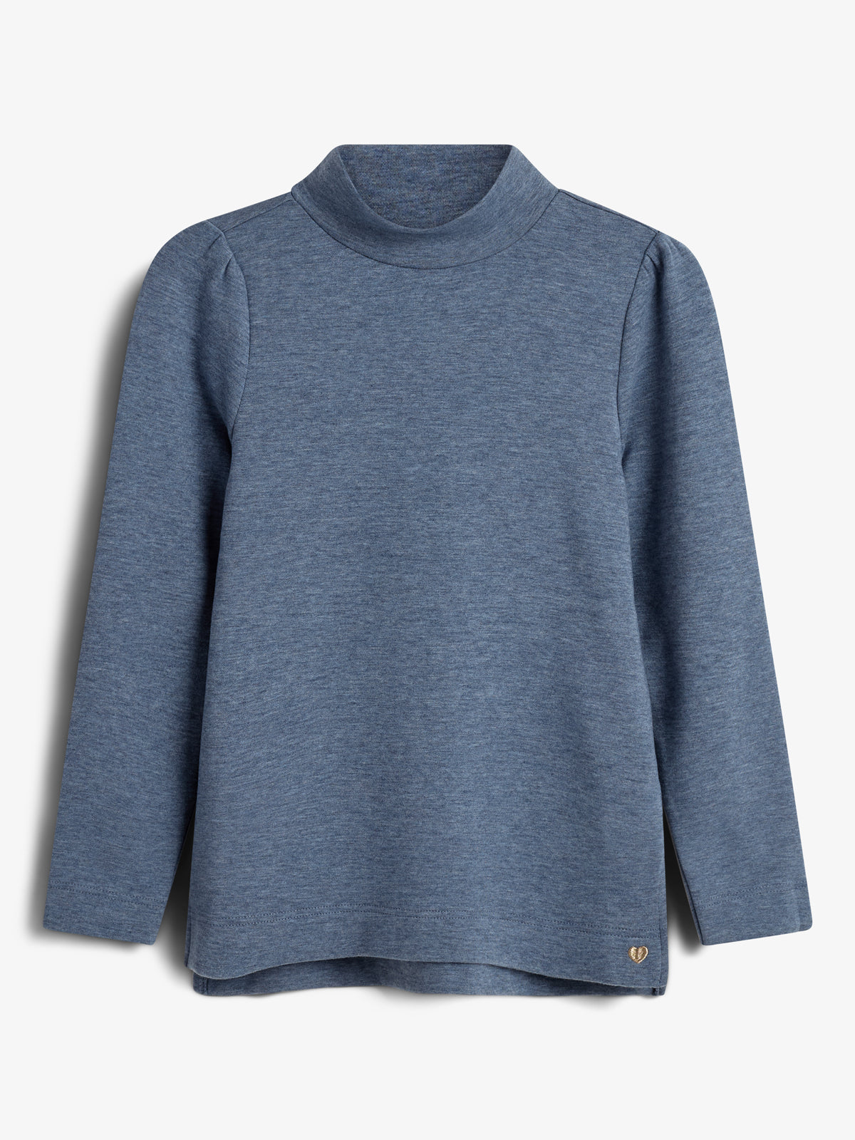 A blue long-sleeve turtleneck shirt hangs against a white background, featuring clean lines and a small, gold heart emblem near the hem.